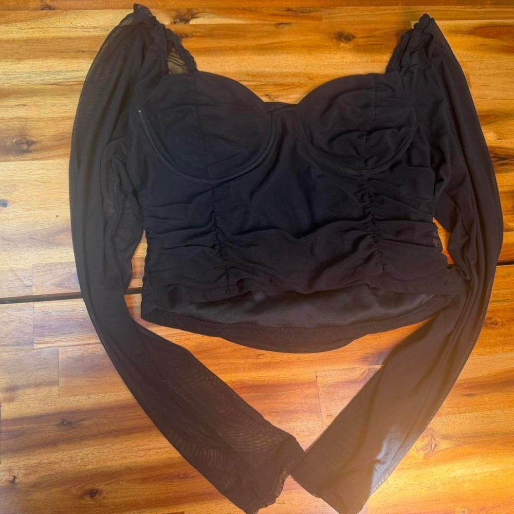Black mesh corset-style crop top from Rue 21 featuring sheer long sleeves